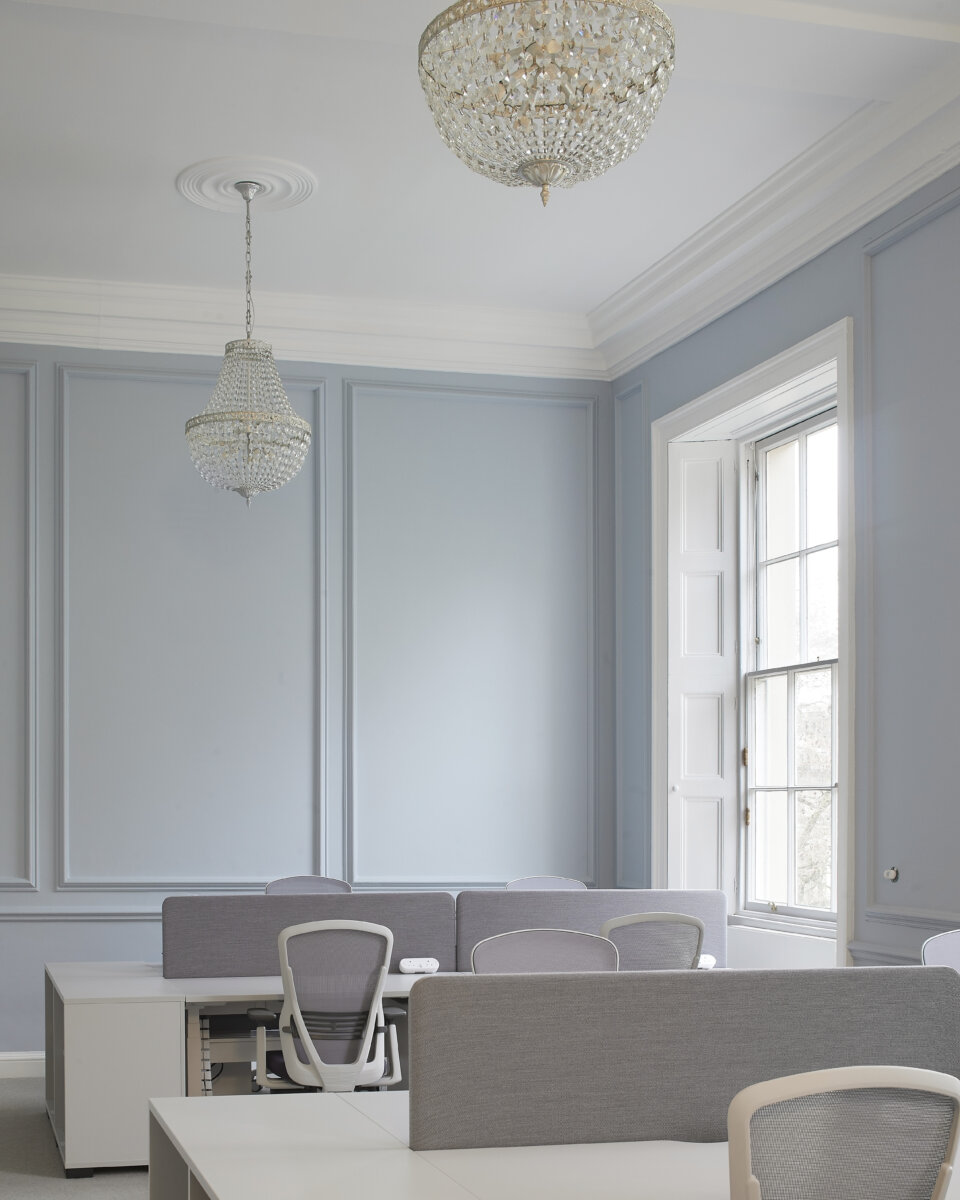 Desks within shared office space in the British Academy designed by Wright & Wright Architects.