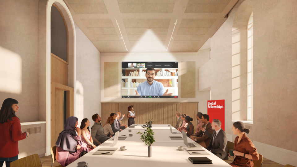 Visualisation of people sat around a meeting table. Screen at the end of the table with a video call on it.