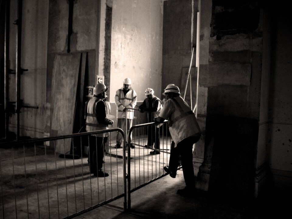 Grayscale image of architects from Wright & Wright on the construction site of the future RIBA Reading Rooms at the V&A Museum in London