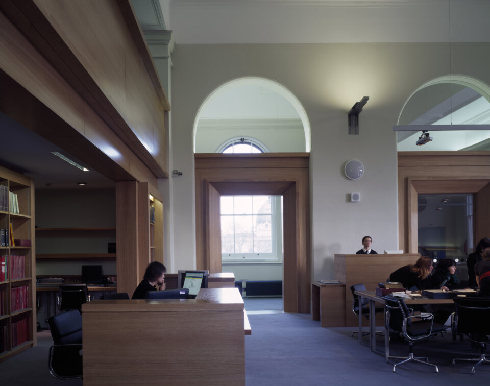 Interiors of the RIBA Reading Rooms at the V&A Museum with people sitting and studying at desks