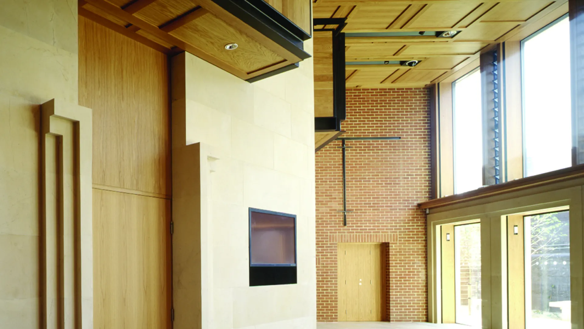 Interior of the foyer of the Women's Library with brick and timber walls designed by Wright & Wright