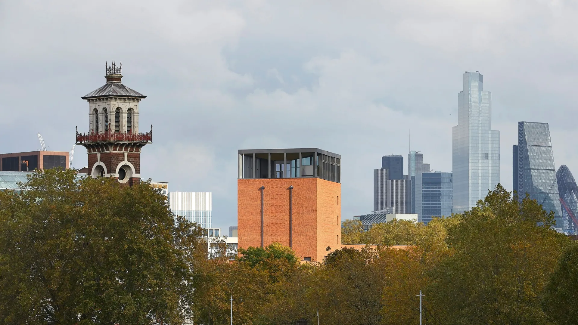 Image of Lambeth Palace Library amidst the London city skyline as seen from the River Thames.