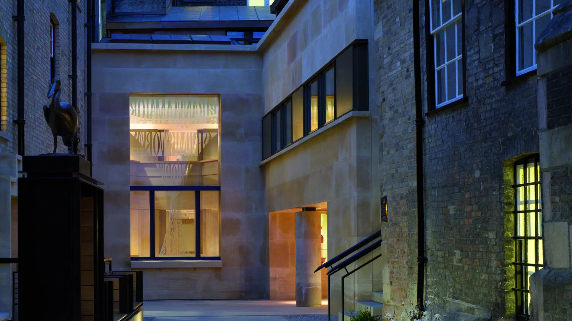Dusk view of entrance to Taylor Library at Corpus Christi College Cambridge