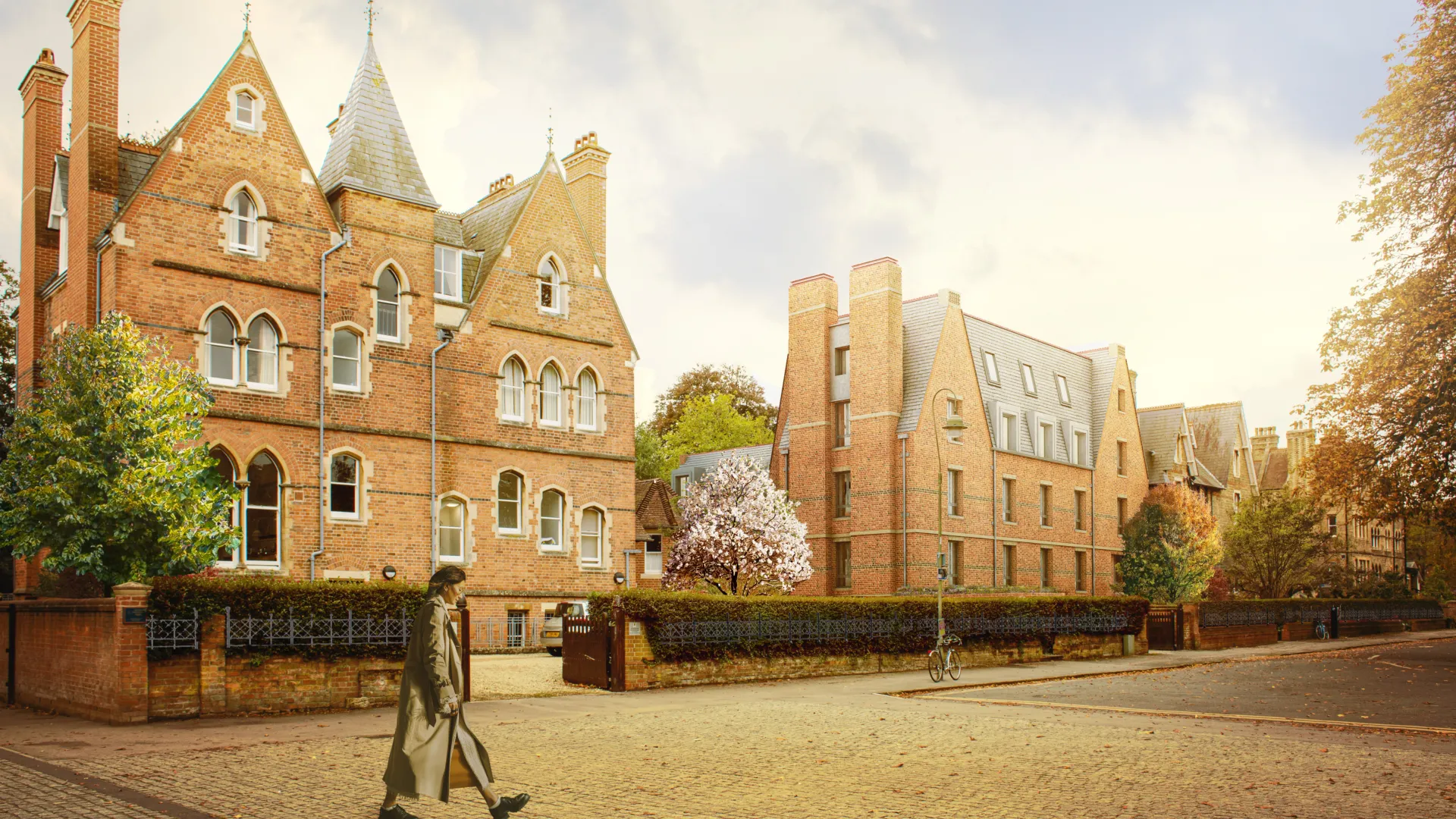 Architectural CGI rendering of a street with several Victorian and contemporary brick buildings along a paved road with a man walking from the left.