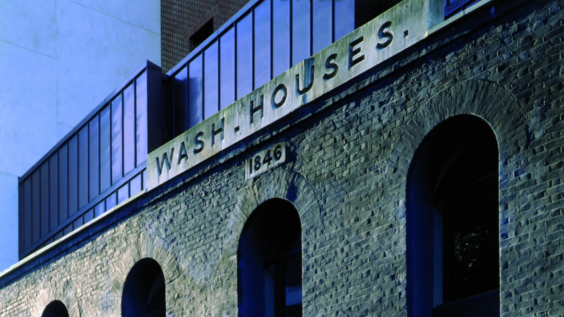 Brick facade with 'Wash houses' sign of the Womens Library designed by Wright & Wright Architects