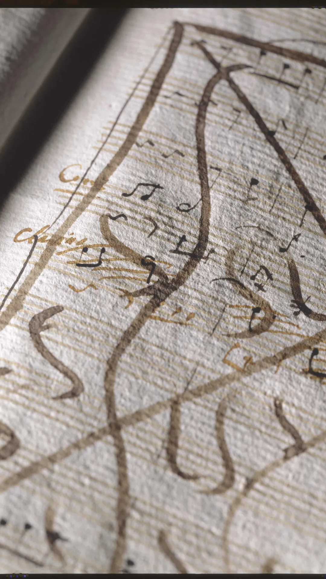 Annotated ancient musical manuscript with brown ink markings