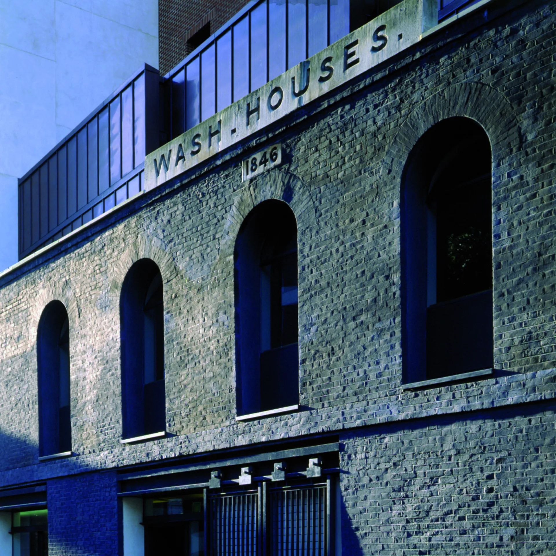 Brick facade with 'Wash houses' sign of the Womens Library designed by Wright & Wright Architects