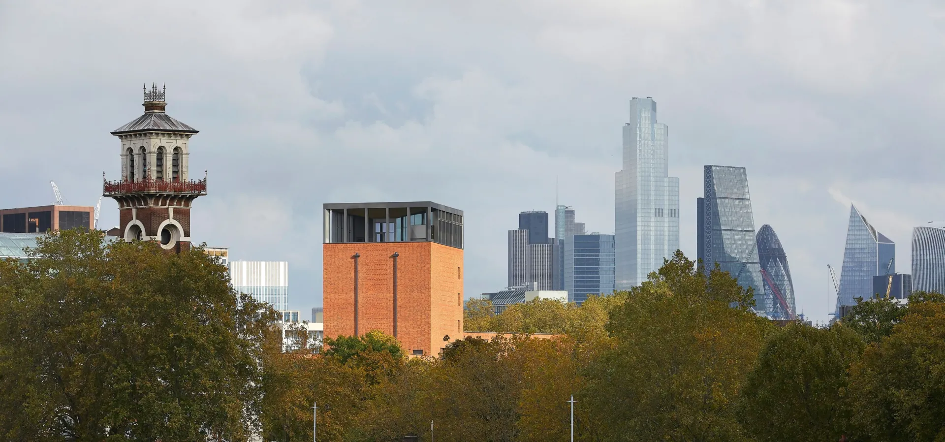 Image of Lambeth Palace Library amidst the London city skyline as seen from the River Thames.