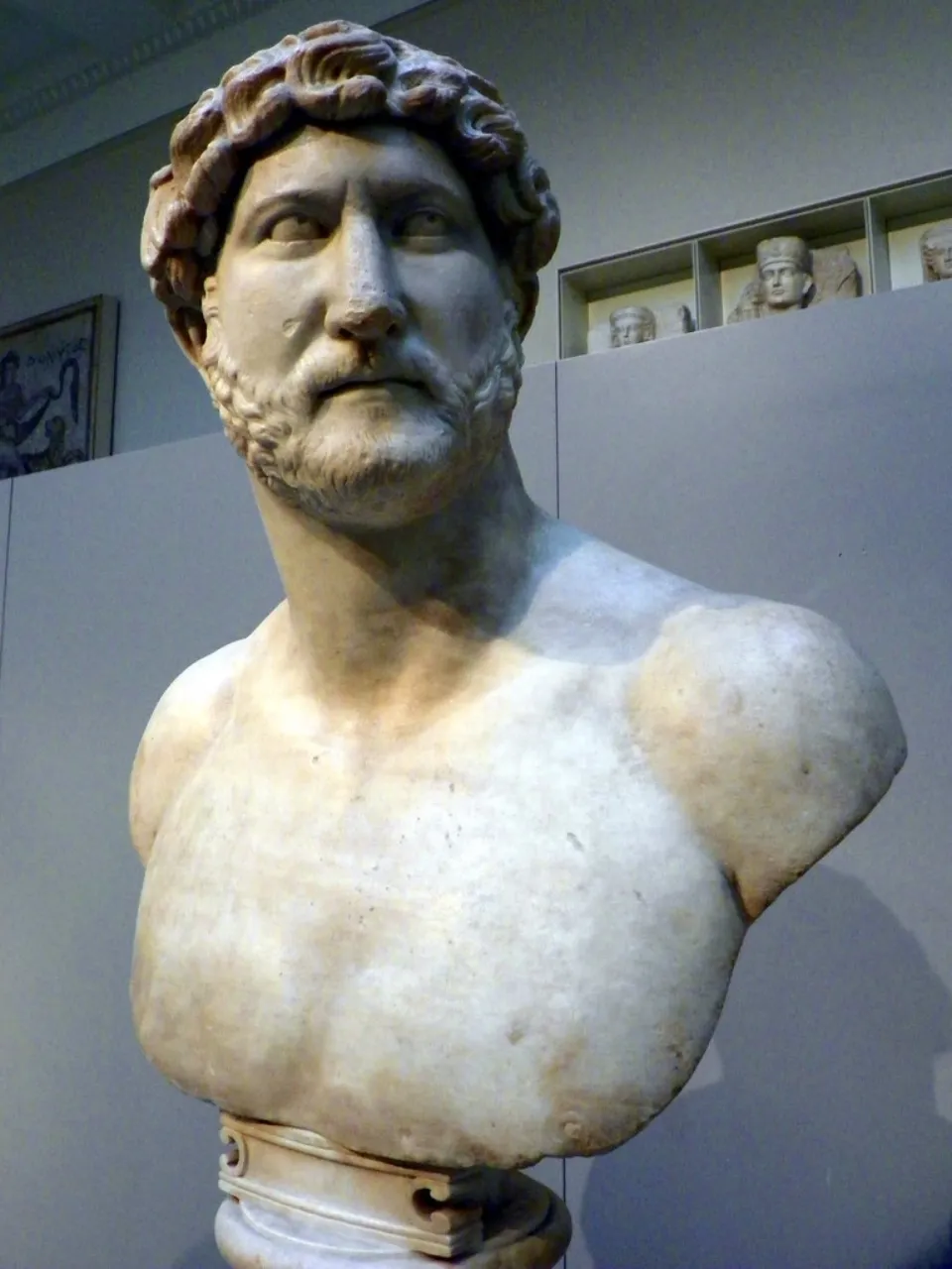 Frontal view of a marble bust of the Emperor Hadrian from Ancient Rome in the galleries of the British Museum