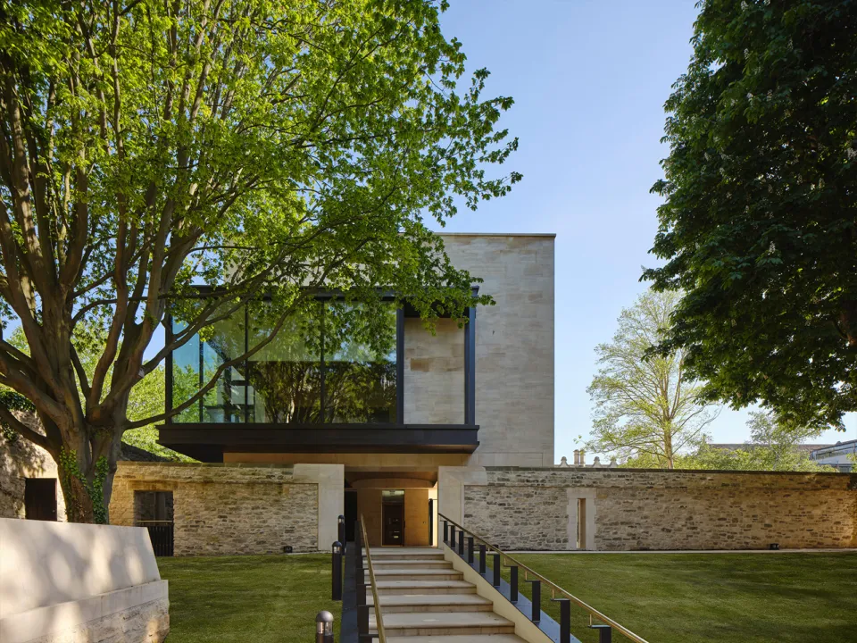 View of the St John's Library and Study Centre behind mature trees