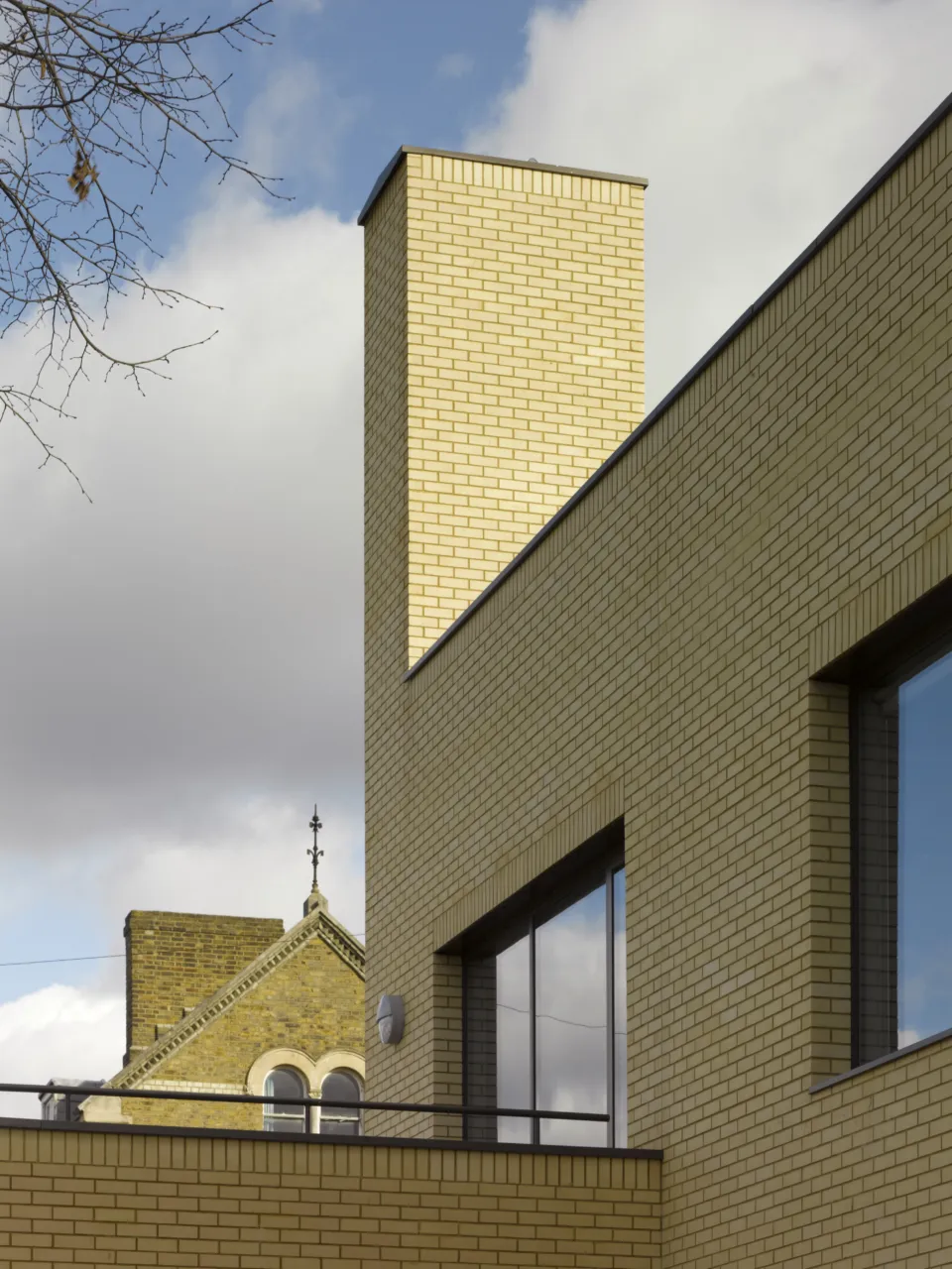 Brick chimney at Newlands School with old brick building beyond
