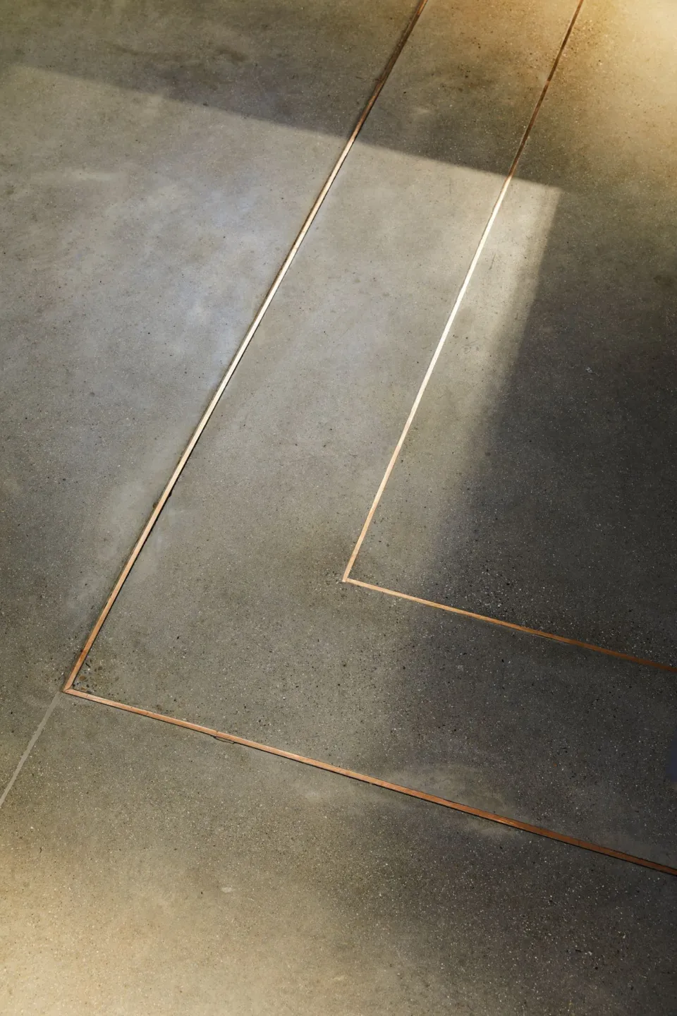 Brass lines in the floors of the Museum of the Home show where the original footprint of the 18th century building once stood