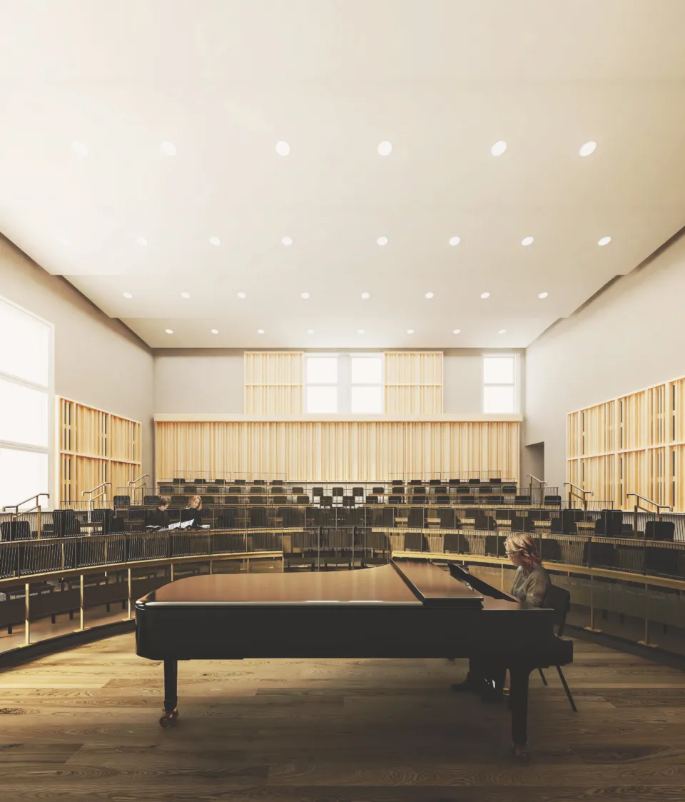 An architectural rendering of an auditorium with a piano at center