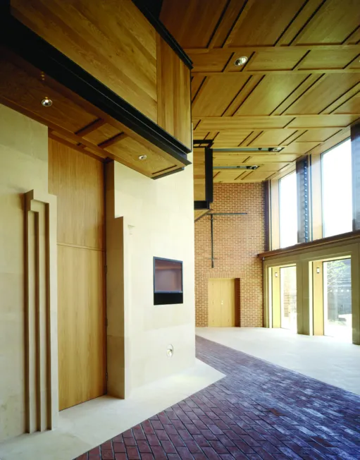 Interior of the foyer of the Women's Library with brick and timber walls designed by Wright & Wright