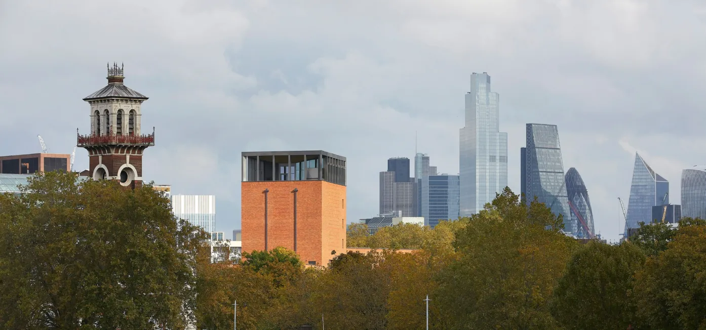 Image of Lambeth Palace Library amidst the London city skyline as seen from the River Thames.