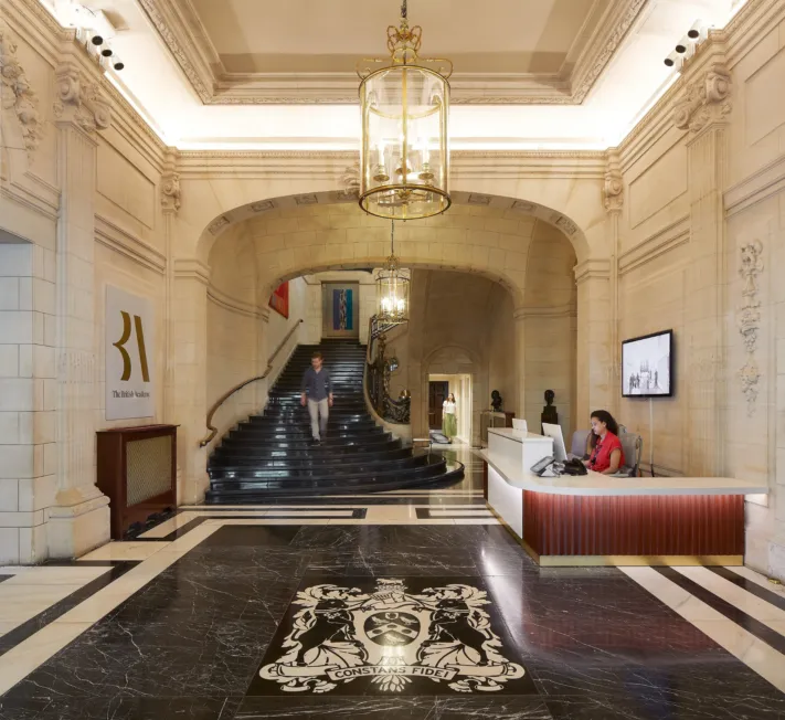 British Academy shot of the lobby by Hufton + Crow, there are 2 receptionists to the right.
