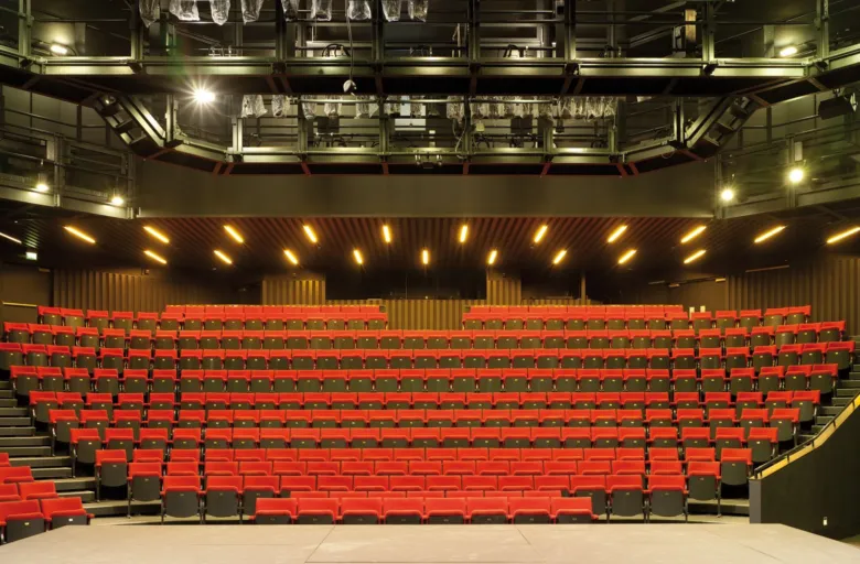 Interior with seats and stage of the Hull Truck Theatre designed by Wright & Wright Architects